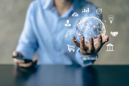 Hand presenting digital globe with media icons, representing social media promotion of pillar content